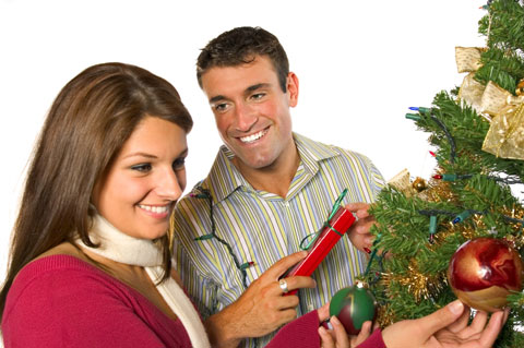 smiling woman receiving a Christmas gift